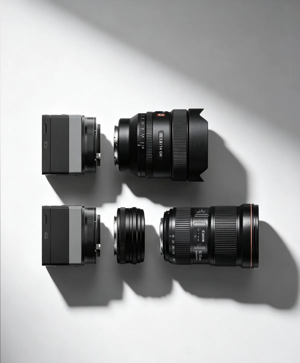 ArcBlue C42 camera body aligned with Sony and Canon camera lenses
