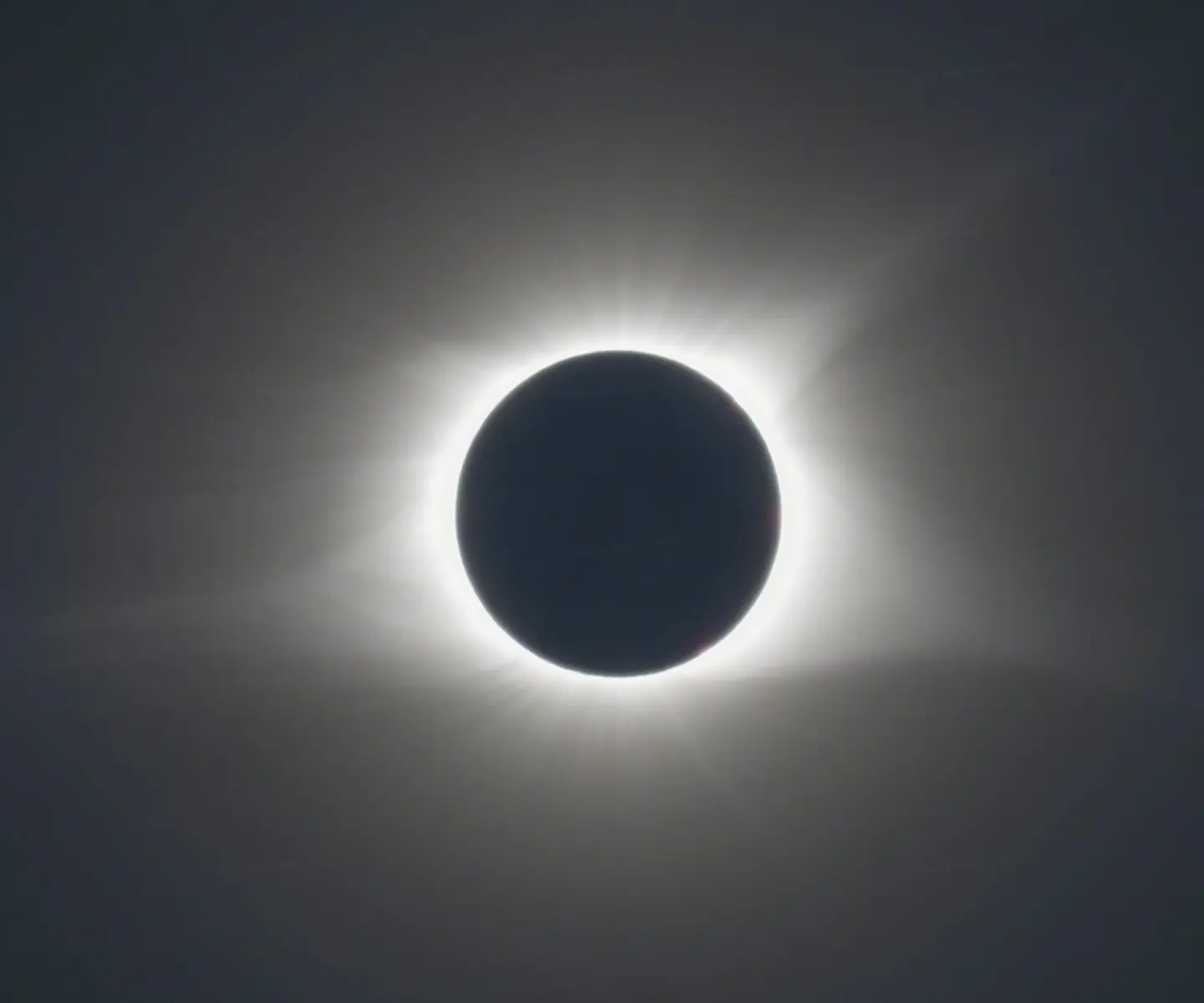 Conventional solar eclipse HDR image with clipped highlights and shadow detail loss