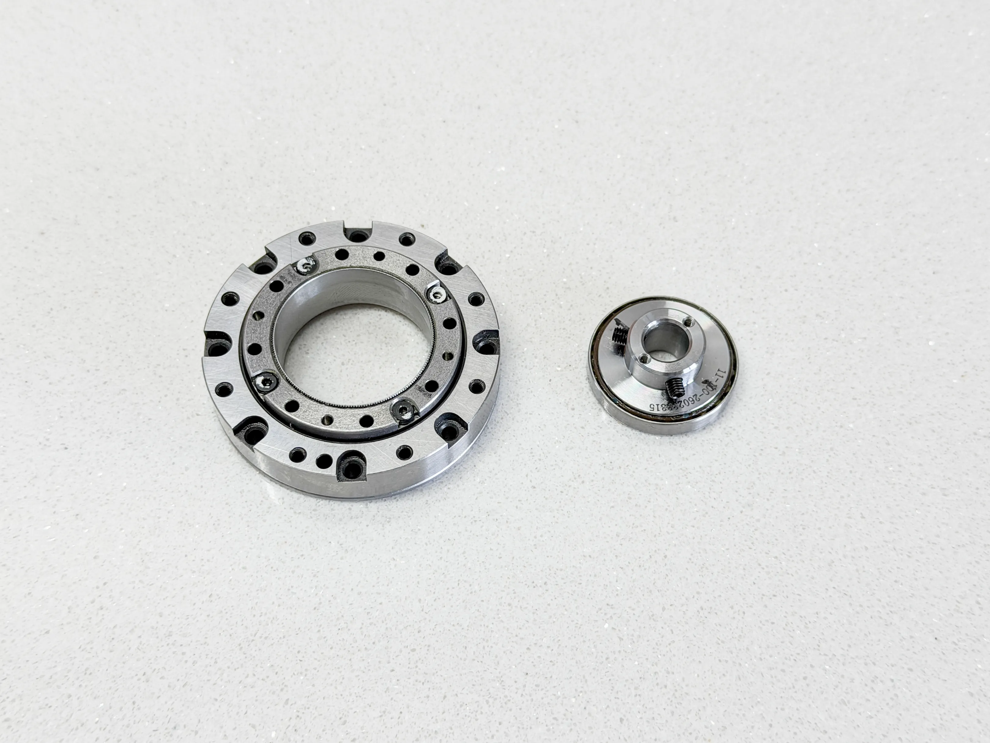 The compact 11 mm harmonic drive used in Pulsar beside a larger harmonic drive.